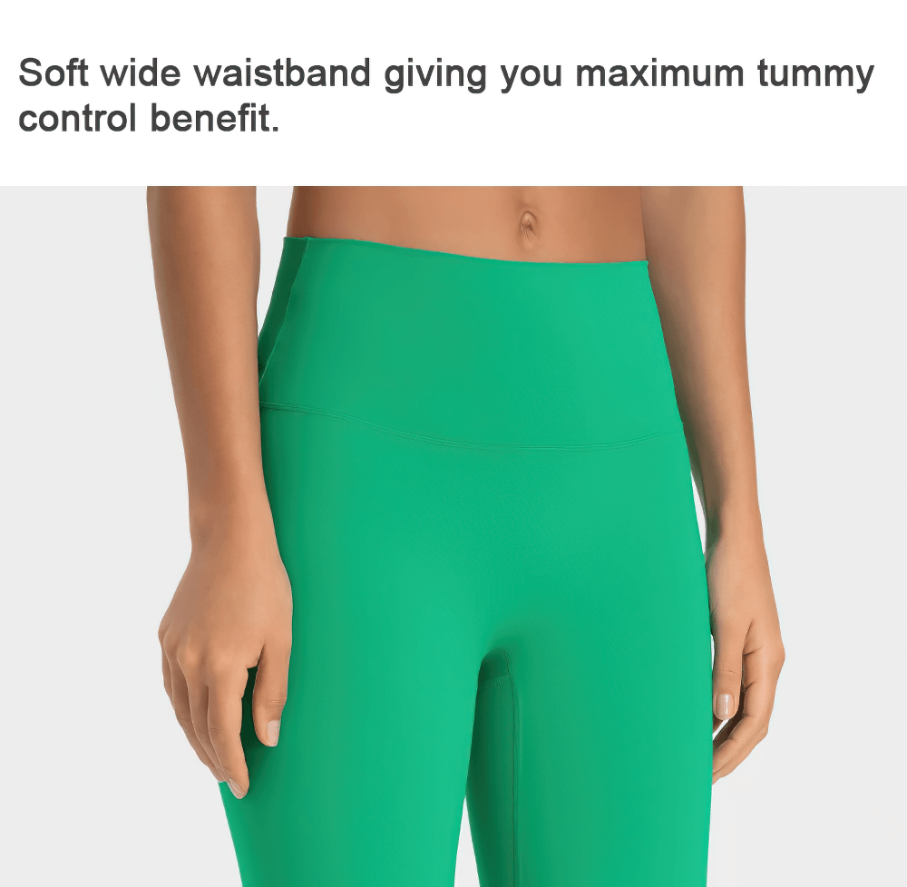 Green yoga leggings with soft wide waistband for tummy control, showcasing a close-up view of the eco-friendly material.